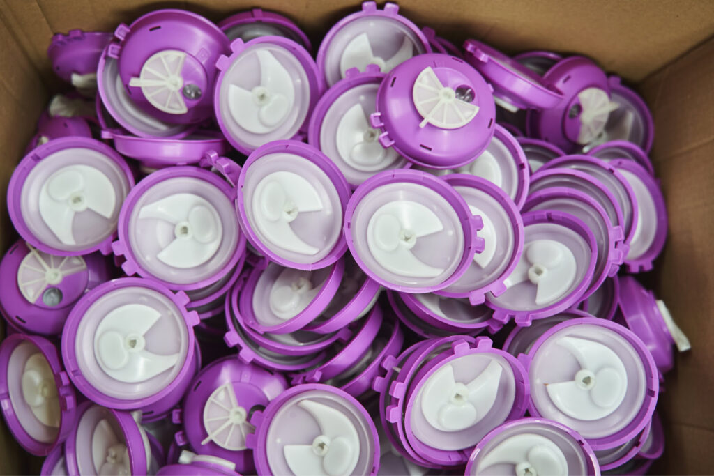 Finished injection moulded components in box