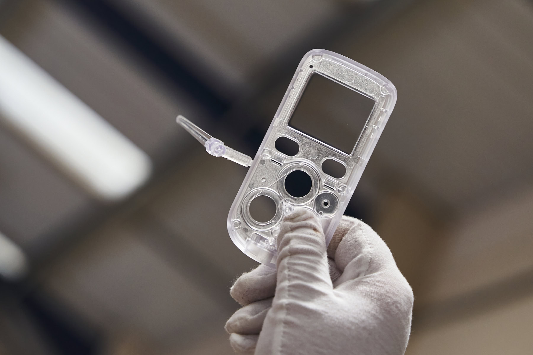 Injection moulded component being inspected