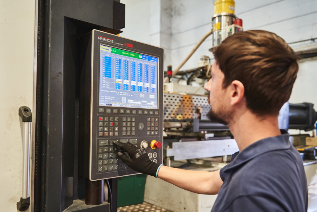 Person operating injection moulding machine